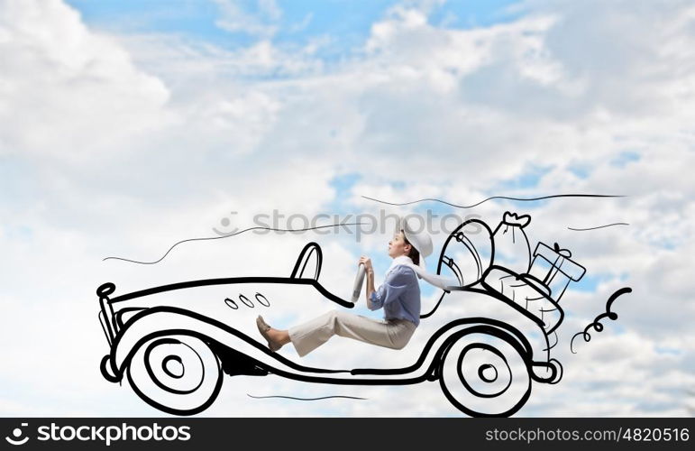 Woman driving old styled drawn car. Young humorous woman driving drawn funny car