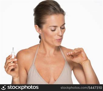 Woman drying nails after nail polish