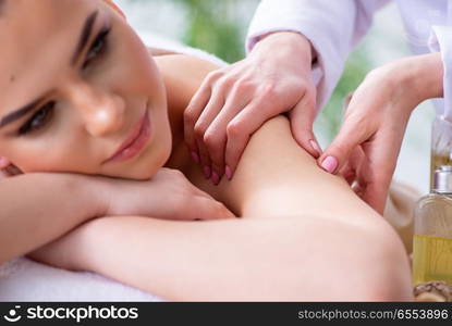 Woman during massage session in spa