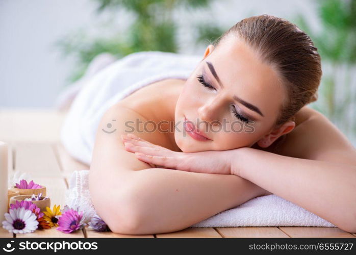 Woman during massage session in spa