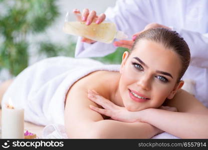 Woman during massage session in spa