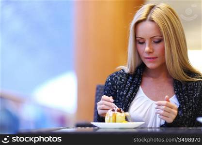 woman eat desert in caffe