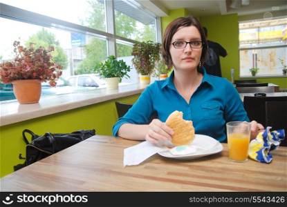 woman eat fast food in restaurant