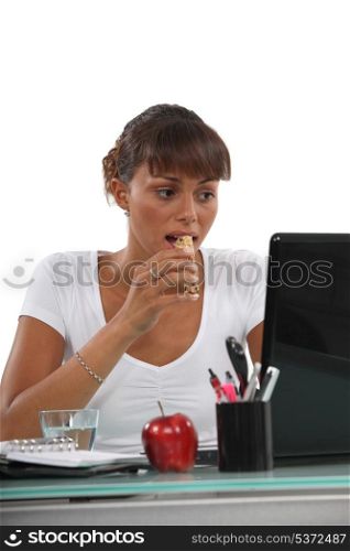 Woman eating a cereal bar