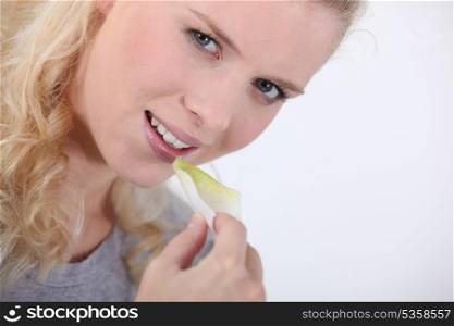 Woman eating a crisp
