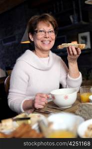 Woman eating a slice of bread