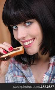 Woman eating a slice of marble cake