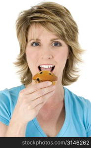 Woman eating blueberry muffin.