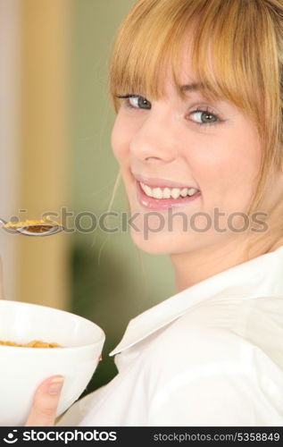 Woman eating cereal