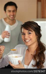 Woman eating cereal for breakfast