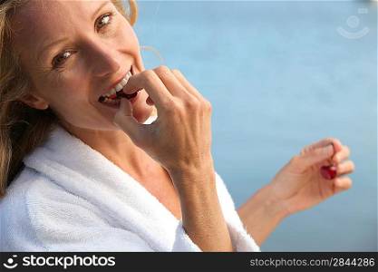 Woman eating cherries