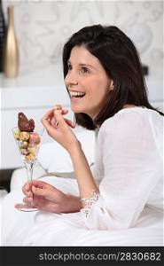 Woman eating chocolate egg