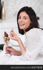 Woman eating Easter chocolate