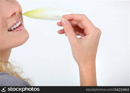 Woman eating endives