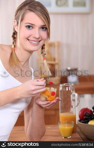 Woman eating fruit