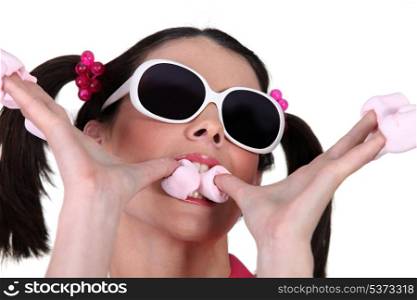 Woman eating marshmallows