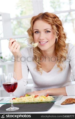 Woman eating pasta for dinner