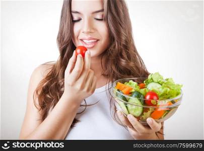 woman eating salad with closed eyes