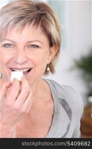 Woman eating sweet