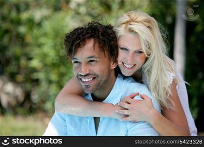 Woman embracing man outdoors