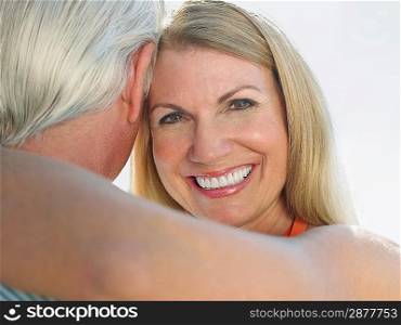 Woman embracing man portrait close up