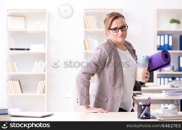 Woman employee going to sports from work during lunch break