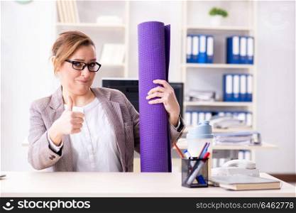 Woman employee going to sports from work during lunch break