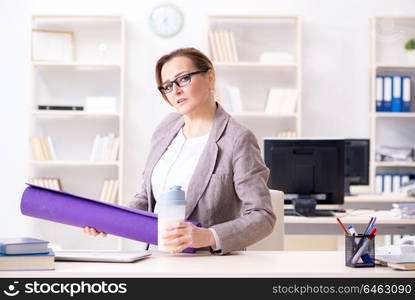 Woman employee going to sports from work during lunch break