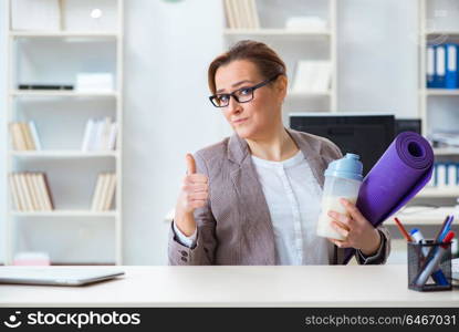 Woman employee going to sports from work during lunch break