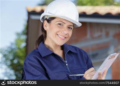 woman engineer and construction worker