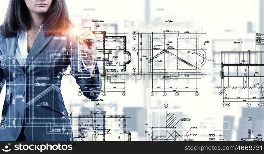Woman engineer at work. Female architect working with virtual construction plan