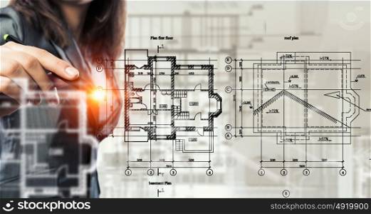 Woman engineer at work. Female architect working with virtual construction plan