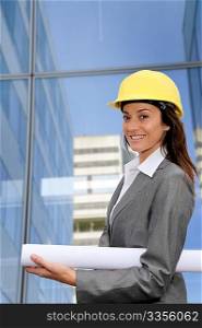 Woman engineer in front of modern building