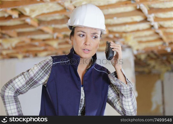 woman engineer on building site checking construction