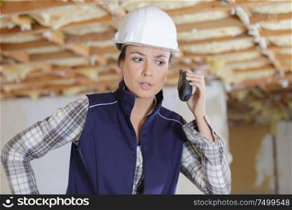 woman engineer on building site checking construction