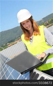 Woman engineer on solar panels site