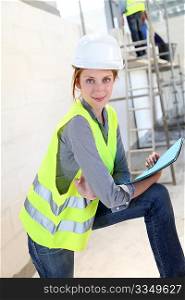 Woman engineer standing on building site