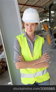 Woman engineer standing on building site