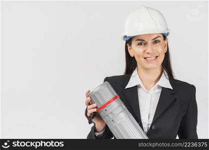 woman engineer white helmet holding tube