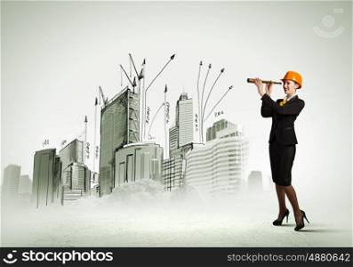 Woman engineer with scope. Woman engineer in helmet with scope against sketch background