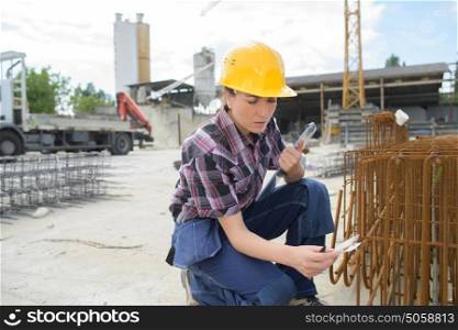 woman engineer working with industrial pipes