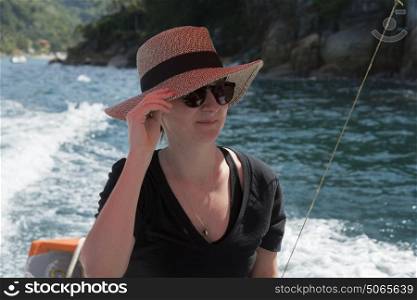 Woman enjoying a boat ride at sea, Jalisco, Mexico