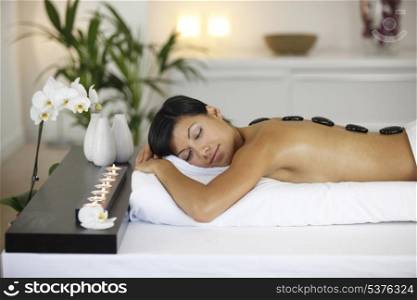 Woman enjoying a hot stone massage