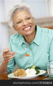 Woman Enjoying A Meal At Home