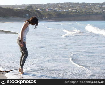 Woman enjoying beach, Roadknight, Victoria, Australia