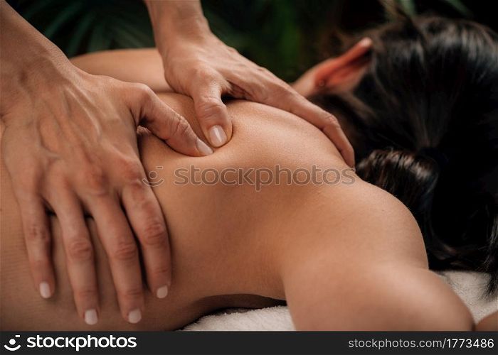 Woman Enjoying Deep Tissue Massage in Salon. Woman Enjoying Deep Tissue Massage