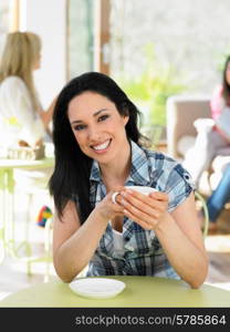 Woman Enjoying Drink In Cafe