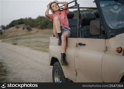 woman enjoying her time while traveling by car