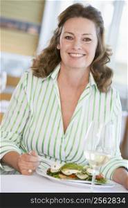 Woman Enjoying meal,mealtime With A Glass Of Wine