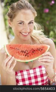 Woman Enjoying Slice Of Water Melon